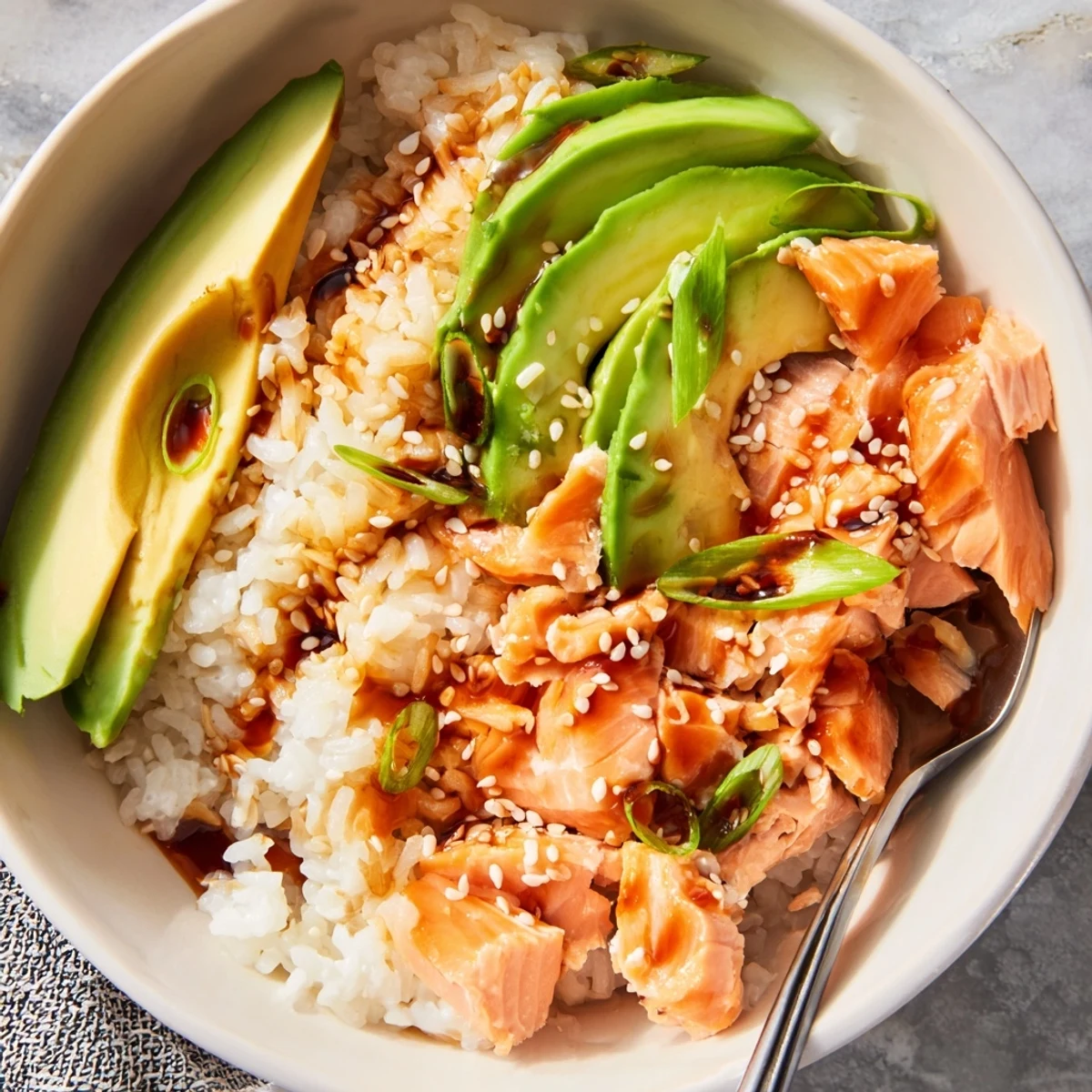 Delicious Leftover Salmon & Rice Bowl served with pickled ginger and sesame seeds.  