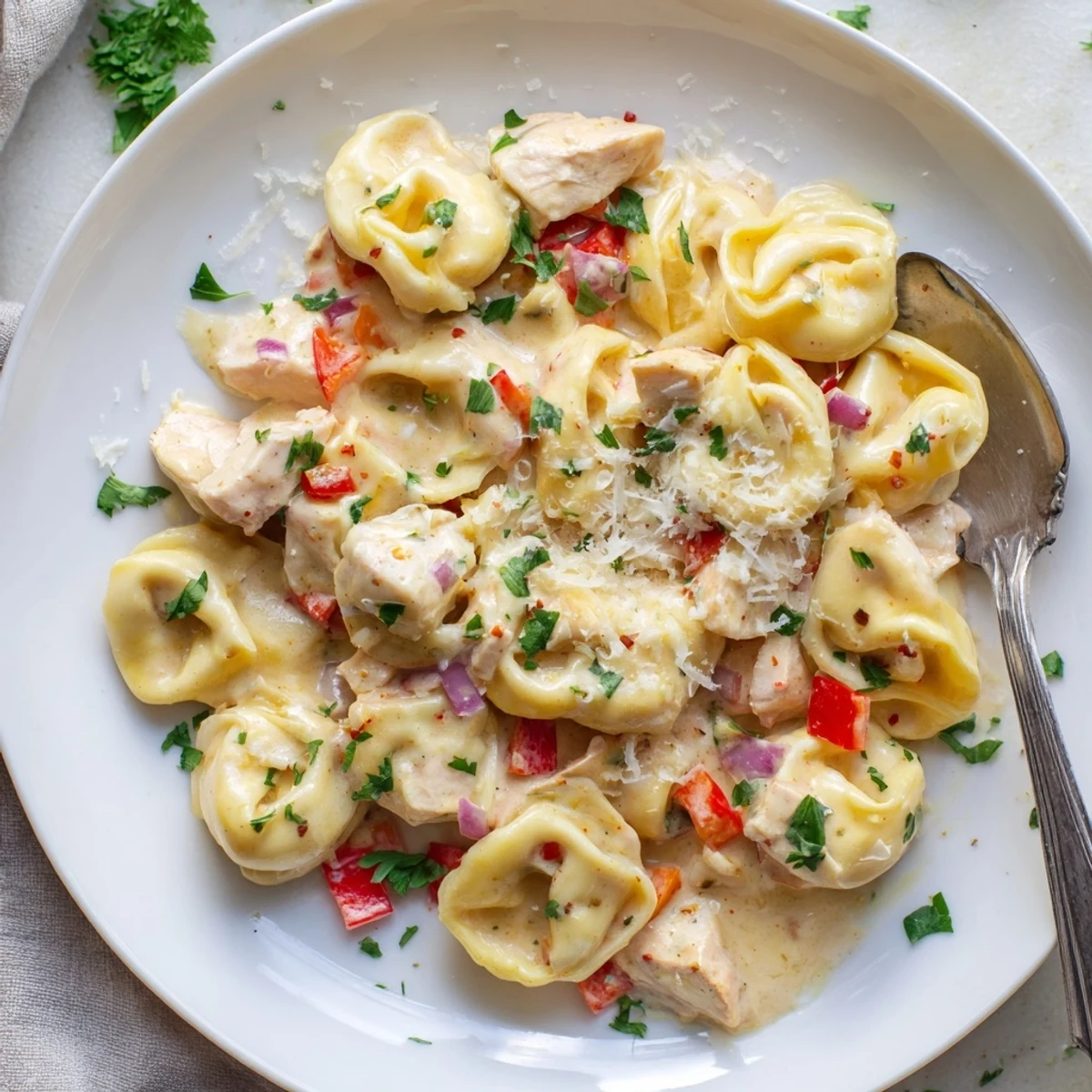 Sizzling Zesty Cajun Garlic Parmesan Chicken Tortellini, featuring vibrant colors and rich flavors.  