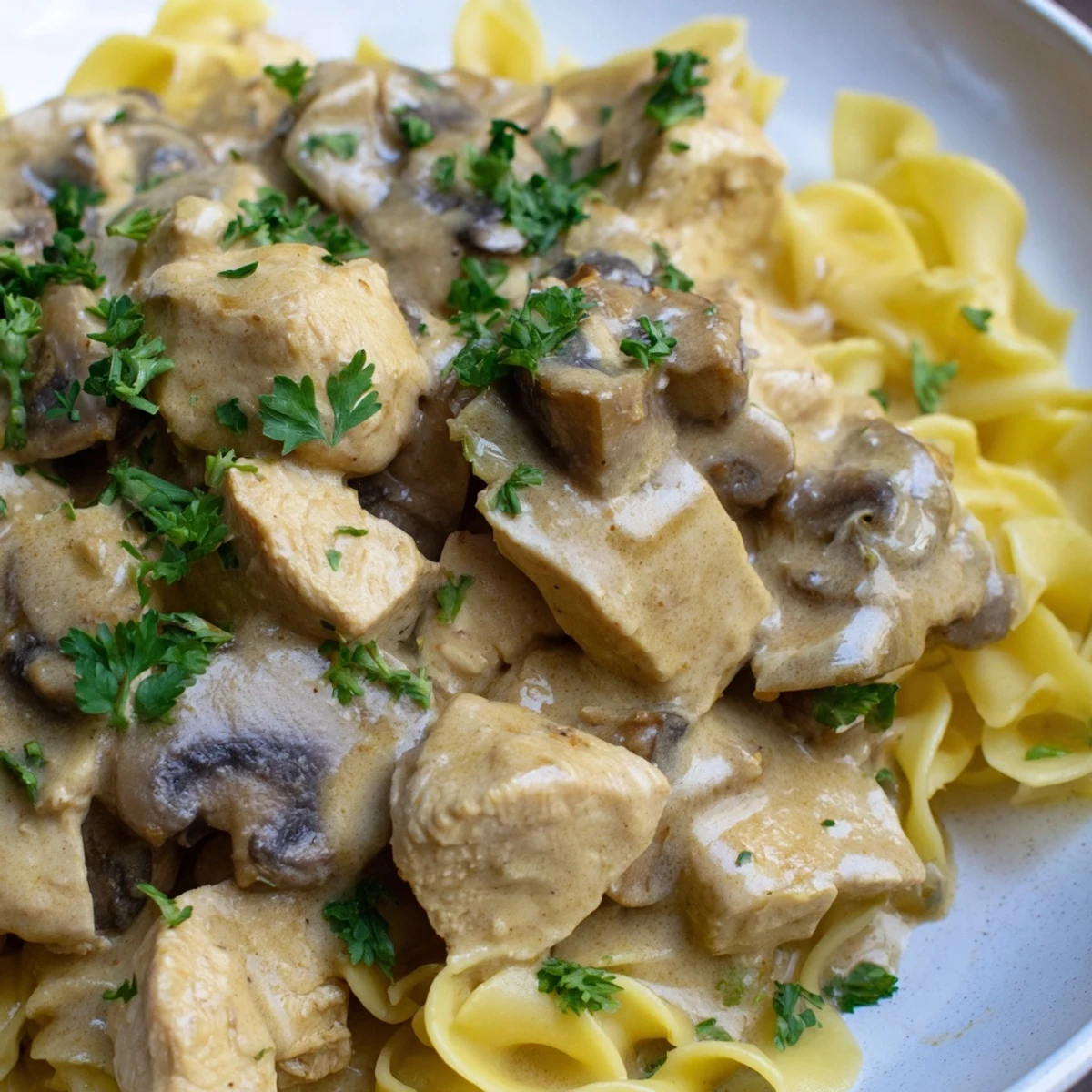Hearty creamy chicken stroganoff with sautéed mushrooms, perfect over rice or noodles.