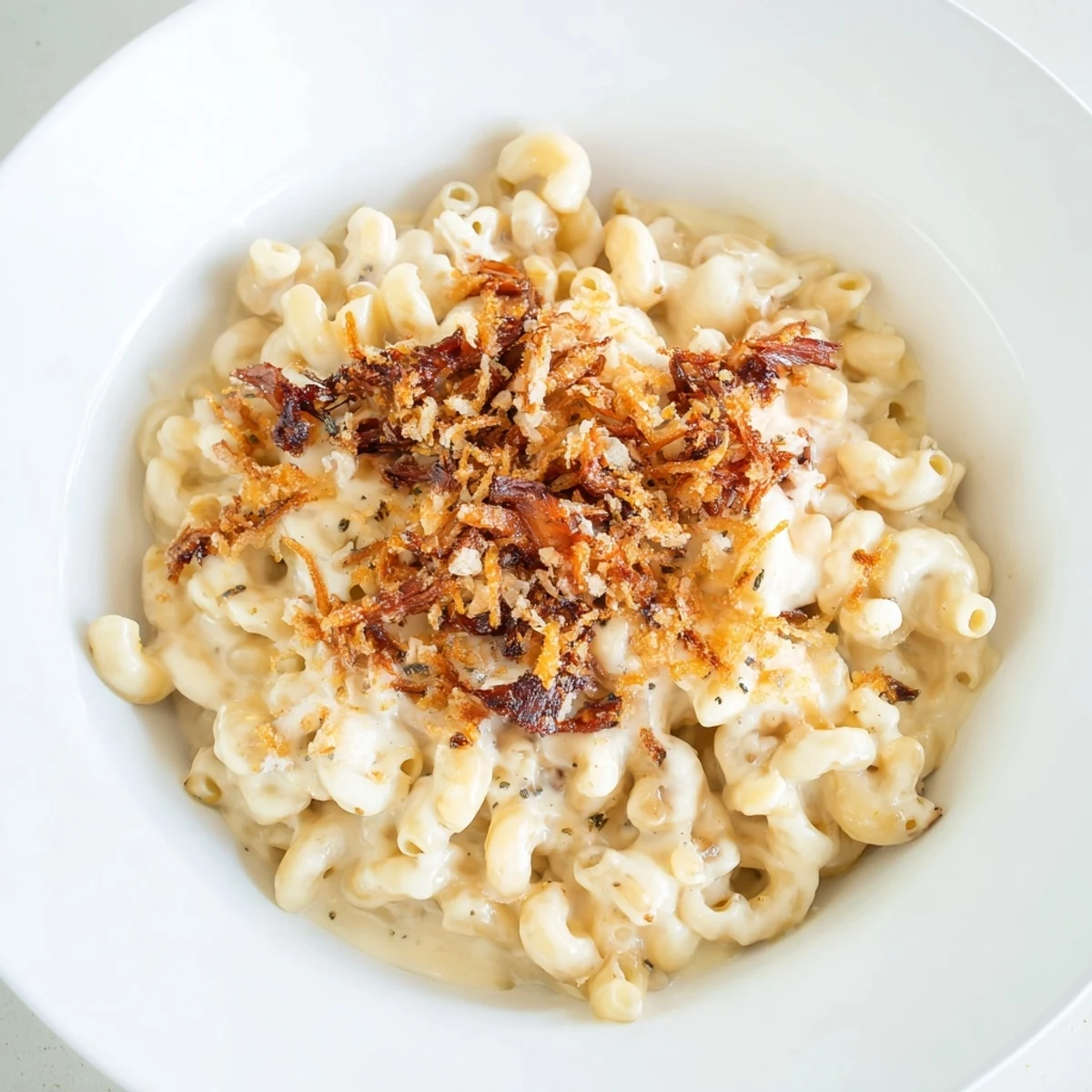 A golden brown baked Classic Mac & Cheese with BBQ Chicken, bubbling with melted cheese and delicious toppings.