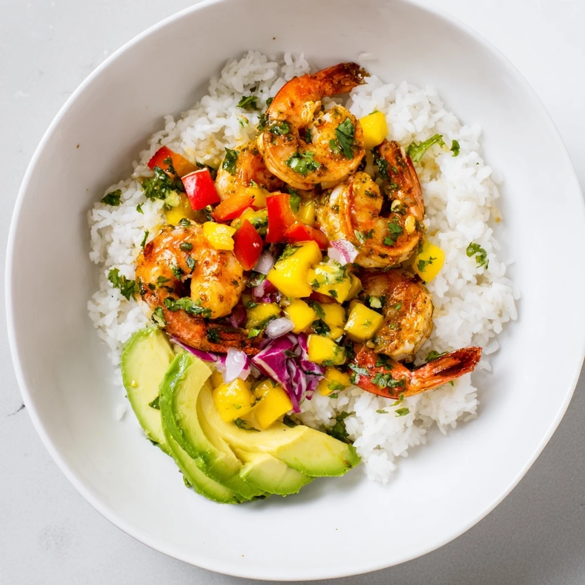 These tasty Cilantro Lime Shrimp & Mango Salsa Bowls are loaded with fresh ingredients and flavorful shrimp.