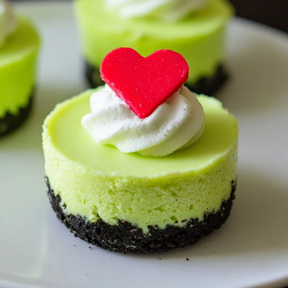 These adorable, creamy Grinch Mini Cheesecakes are a perfect holiday dessert, ready to enjoy anytime.