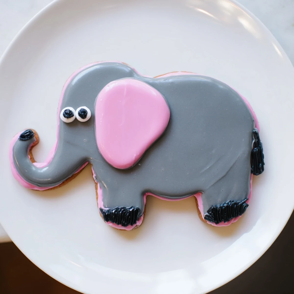 Giant Biscuits Amical Éléphant cookies, beautifully iced with gray and pink, perfect for sharing!