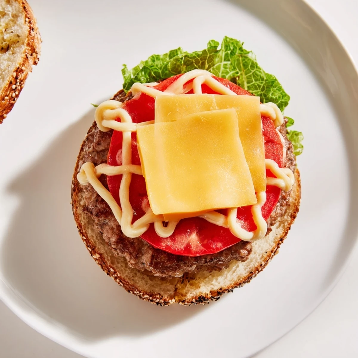 A close-up of fresh, oval American Football Oval Burgers, topped with melted cheese and served with sides.
