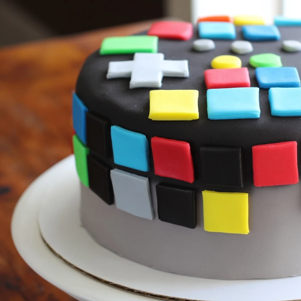 Deliciously moist vanilla cake crafted into a retro Pixel Video Game Controller Cake, garnished for a special dessert.