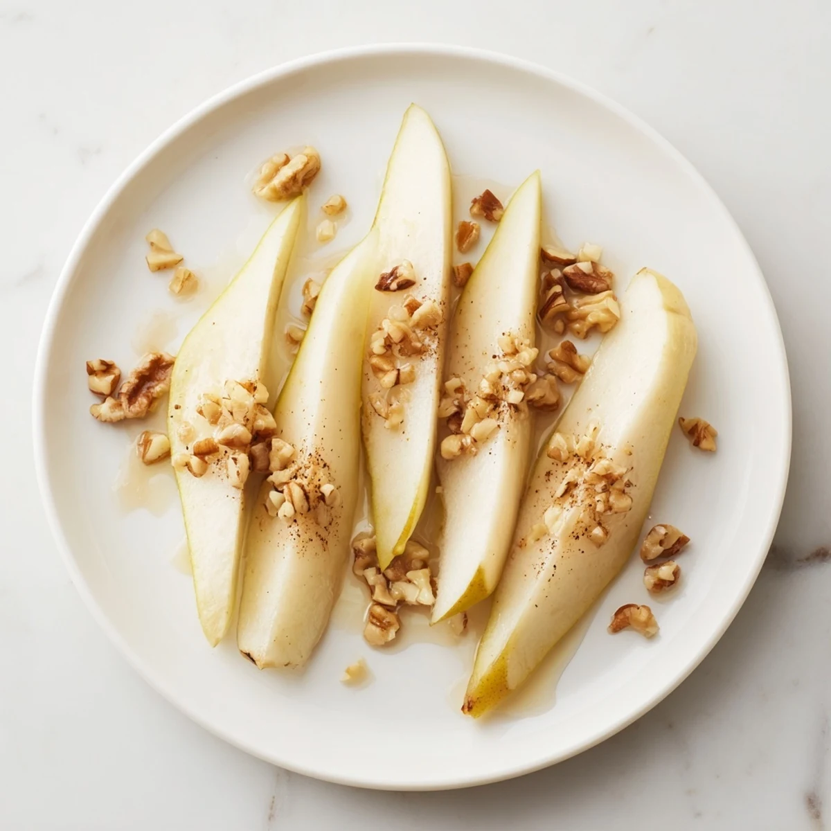 Close-up of vibrant pear slices topped beautifully with sweet honey right before serving.