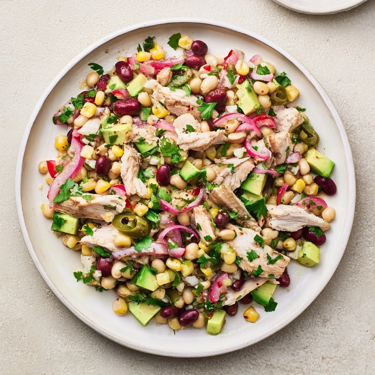 Close-up of a colorful Dense Southwestern Bean Salad, showcasing fresh ingredients and zesty dressing.