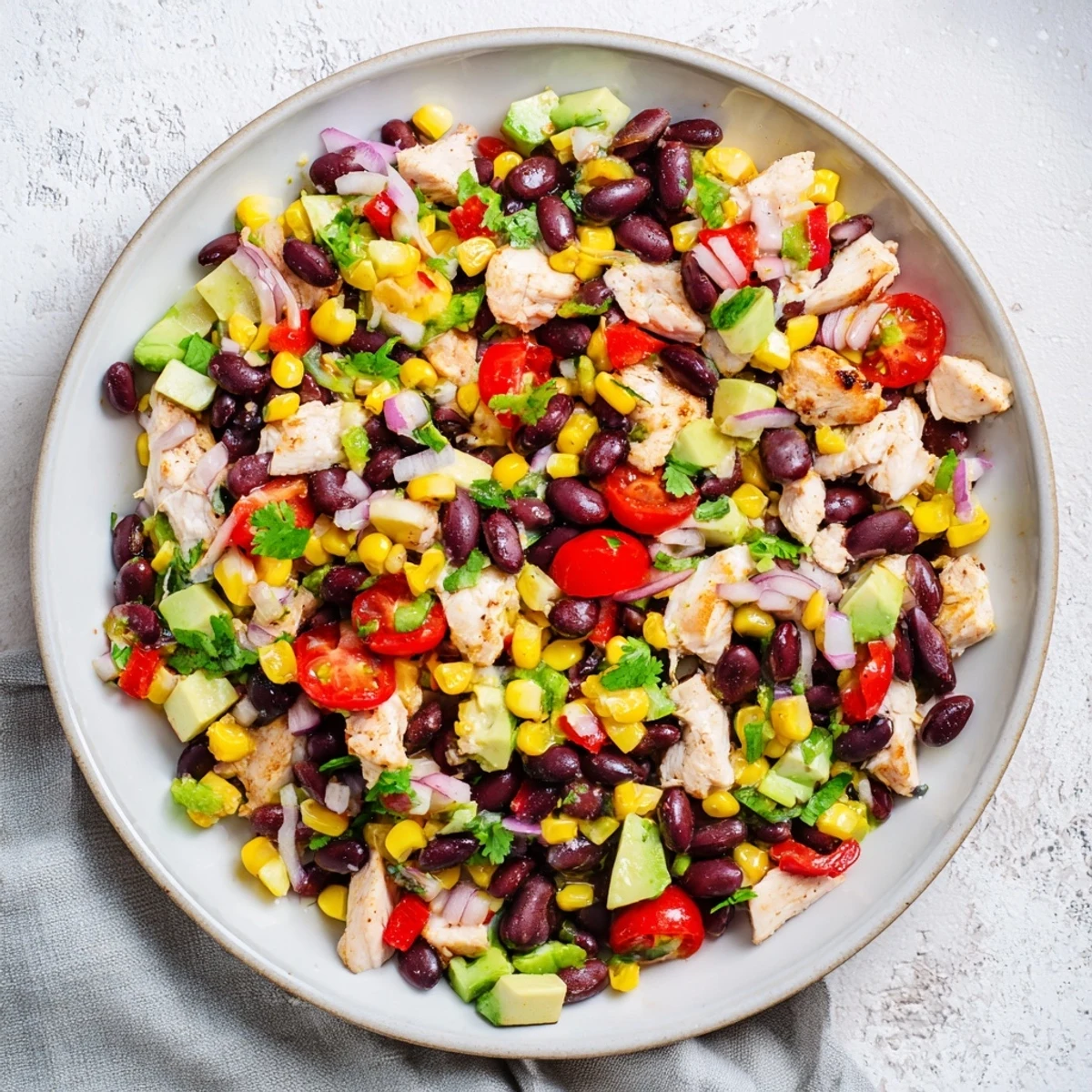 Enjoy this refreshing and protein-packed Dense Southwestern Bean Salad, ideal as a party dip.