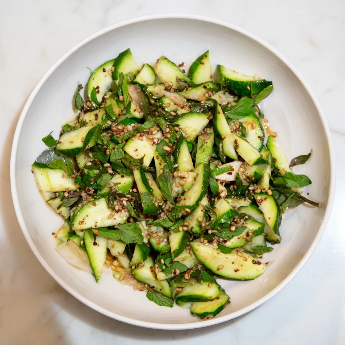 Tossed Whole Cucumber Logan Salad with rotisserie chicken: a delicious, gluten-free meal.