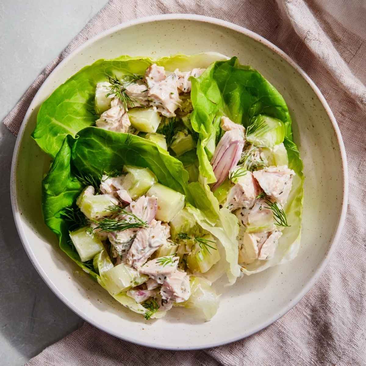Close-up of a delightful pickle sandwich, showcasing flavorful chicken salad tucked inside crisp pickles.
