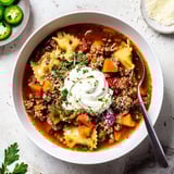 Comforting bowl of Lasagne Soup with spicy jalapeños and creamy cheese blend.