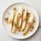 Close-up of vibrant pear slices topped beautifully with sweet honey right before serving.