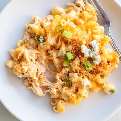 Rich buffalo chicken dip mac and cheese baked until golden and bubbly, perfect for gatherings.  
