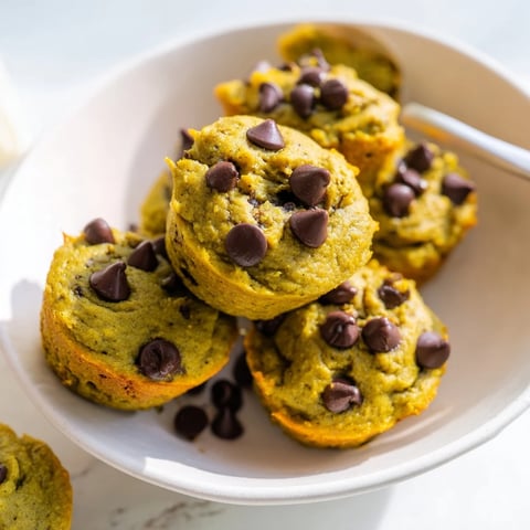 Delicious matcha pumpkin chocolate muffin bites topped with mini chocolate chips.  