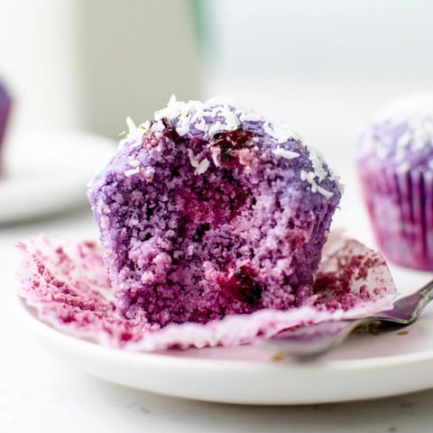 Soft and chewy Ube Cranberry Mochi Muffins, bursting with vibrant flavor and color.  
