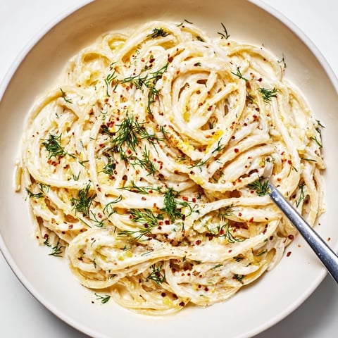 Creamy Turkish garlic yogurt pasta topped with spiced butter and fresh herbs.  