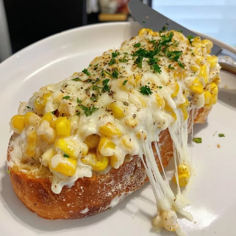 Golden Buttered Corn Toast garnished with parsley, a tasty breakfast delight.  