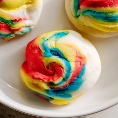Fluffy cloud bread in vibrant rainbow colors, perfect for festive gatherings.  