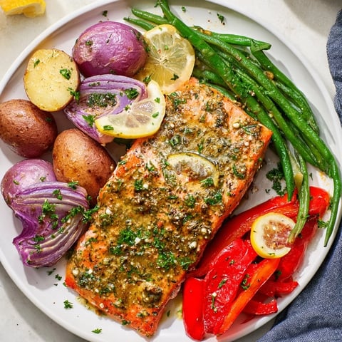 Tender Lemon Herb Salmon & Potato Sheet Pan with vibrant vegetables and zesty flavors.  