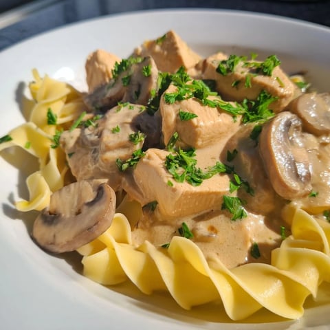 Tender chicken stroganoff nestled in creamy mushroom sauce over buttery noodles.  