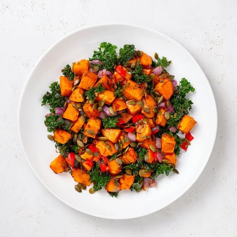Golden brown Maple Glazed Sweet Potato & Kale Hash, a savory and sweet vegetarian delight, ready to be enjoyed.