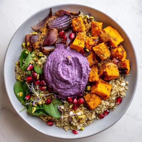 Warm, inviting image of Spiced Winter Bowls with roasted vegetables, pomegranate, and creamy toppings.