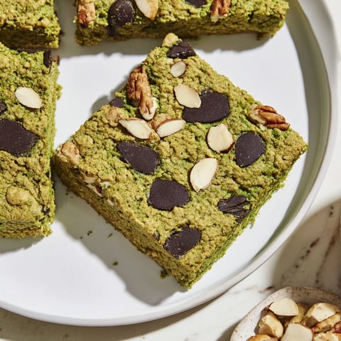 Close-up of Matcha Gingerbread Cookie Dough Protein Bites, ready to eat, featuring a vibrant green hue.