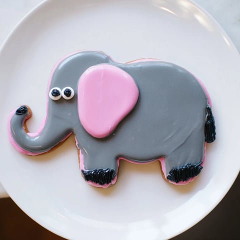Giant Biscuits Amical Éléphant cookies, beautifully iced with gray and pink, perfect for sharing!