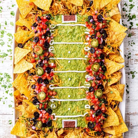 Golden, melted cheese covers this Football Field Nacho Platter, ready for a game day feast.