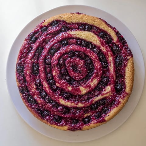 Vibrant Cranberry Orange Swirl cake, with beautiful cranberry swirls, ready to slice and enjoy.