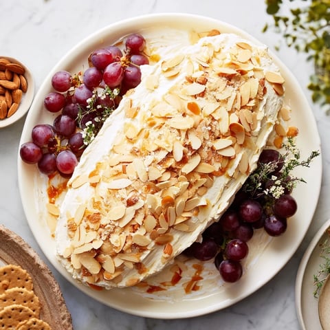 Snowy Pinecone Centerpiece appetizer, dusted with powdered sugar, ready for a winter holiday table.