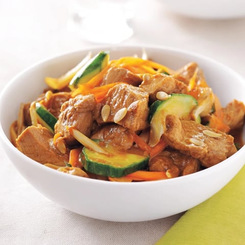 Deli Container Shaker Chicken Salad with crisp cucumber and tangy dressing, ready for lunch.